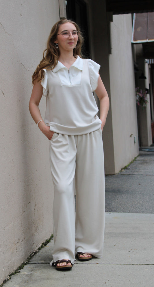 UMGEE RUFFLE SLEEVELESS ZIP FRONT TOP